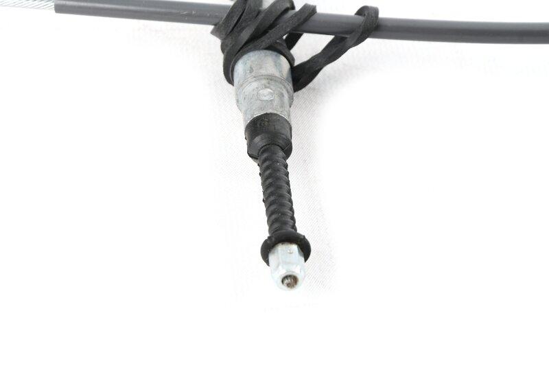 Трос стояночного тормоза Л