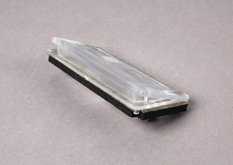 Рассеиватель фонаря подсв.номерн.знака